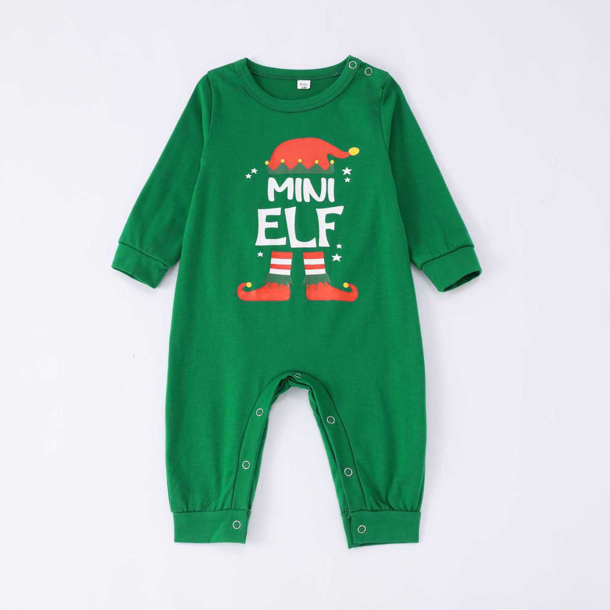 Tutina natalizia verde Mini Elf per neonato con cappello e stivali da elfo, bottoni automatici sulle spalle e alle gambe, su sfondo bianco.