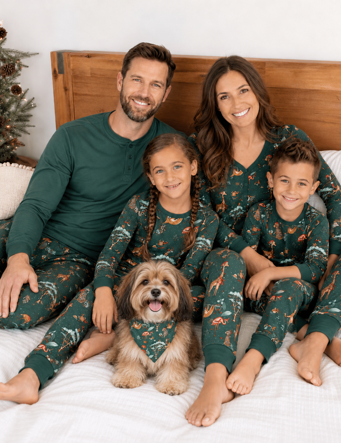 Family in matching Christmas pajamas with a Havanese wearing the coordinating triangular dog bandana.