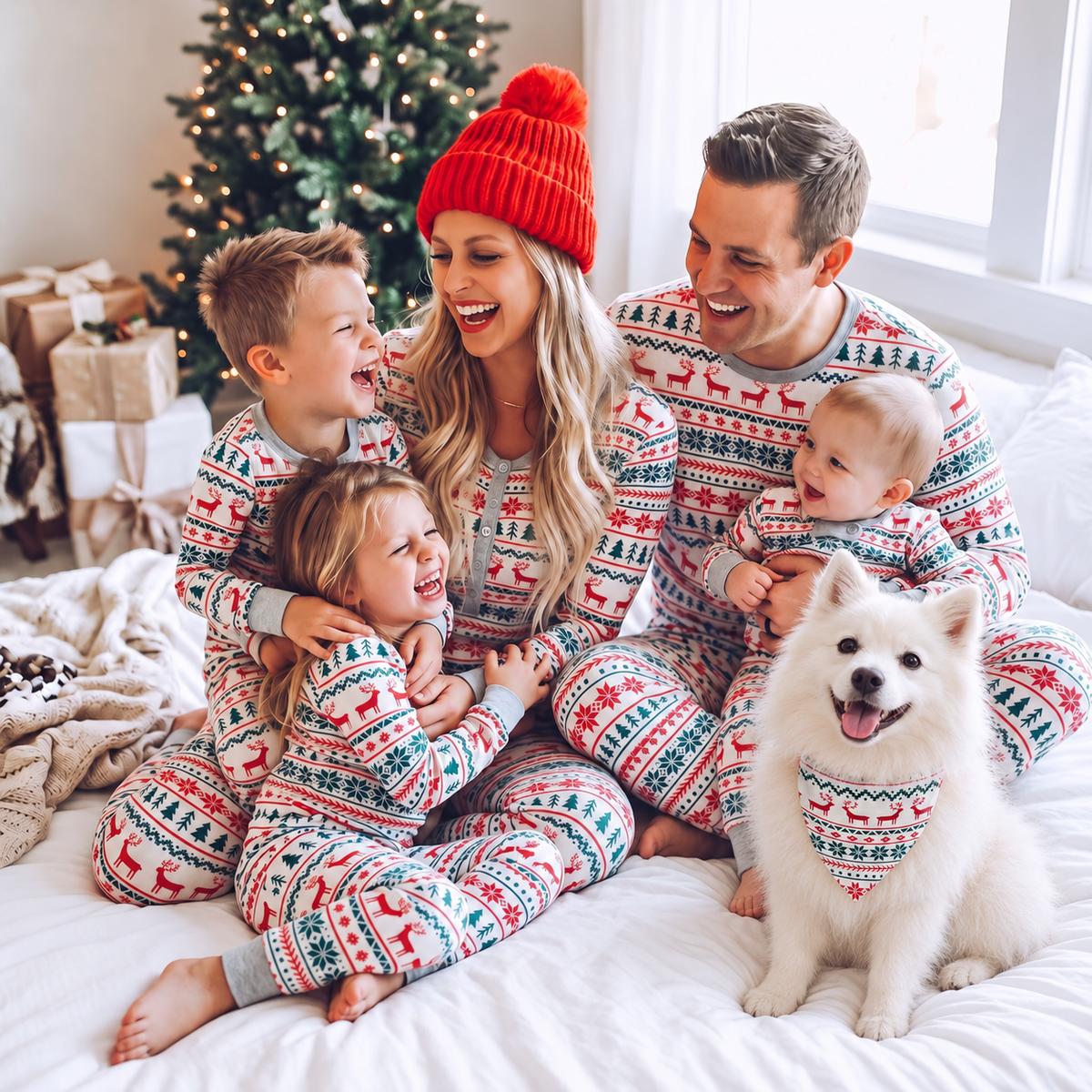 Family in matching Christmas pajamas with a Japanese Spitz wearing the matching triangular dog bandana.