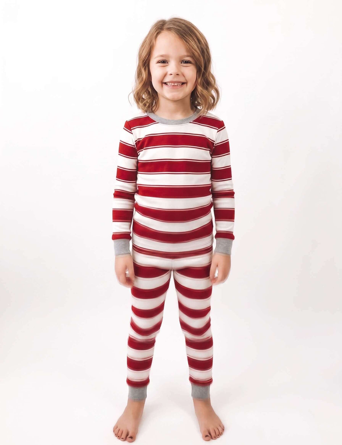 Girls' red and white striped holiday pajama set with crew neck and ribbed cuffs