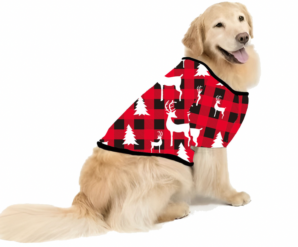 Golden retriever wearing a red and black plaid Christmas dog shirt with white tree and reindeer prints.