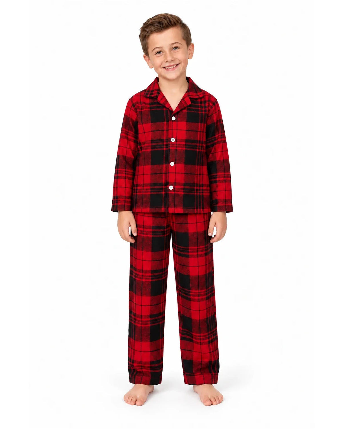 Boy wearing a red and black tartan button-front pajama shirt and matching long pants.