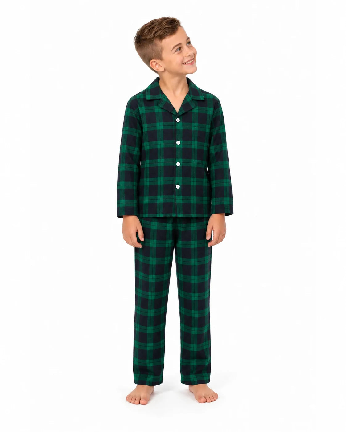 Boy wearing a green and black plaid button-front pajama shirt and matching pants, front view.