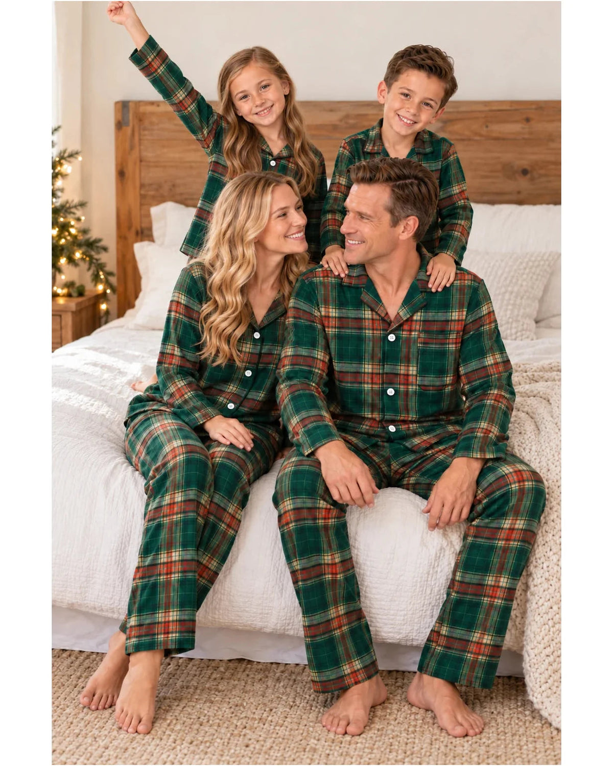 Children stand behind their seated parents, all wearing matching light green tartan pajamas.