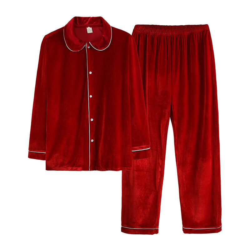Red button-front pajama top and matching pants with white piping laid flat on a white background.