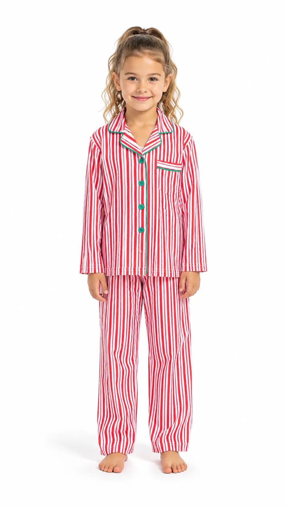 Girl modeling red-and-white vertically striped button-front pajamas with green piping against a white background.