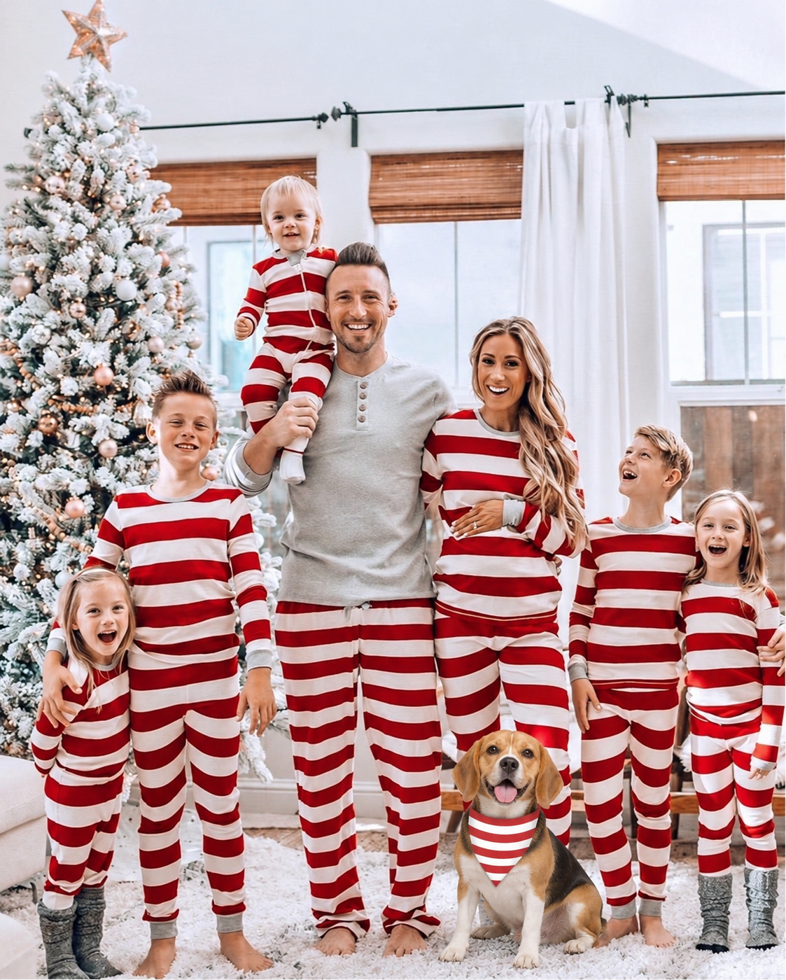 Family wearing matching Christmas pajamas with a Beagle wearing the coordinating triangular dog bandana.