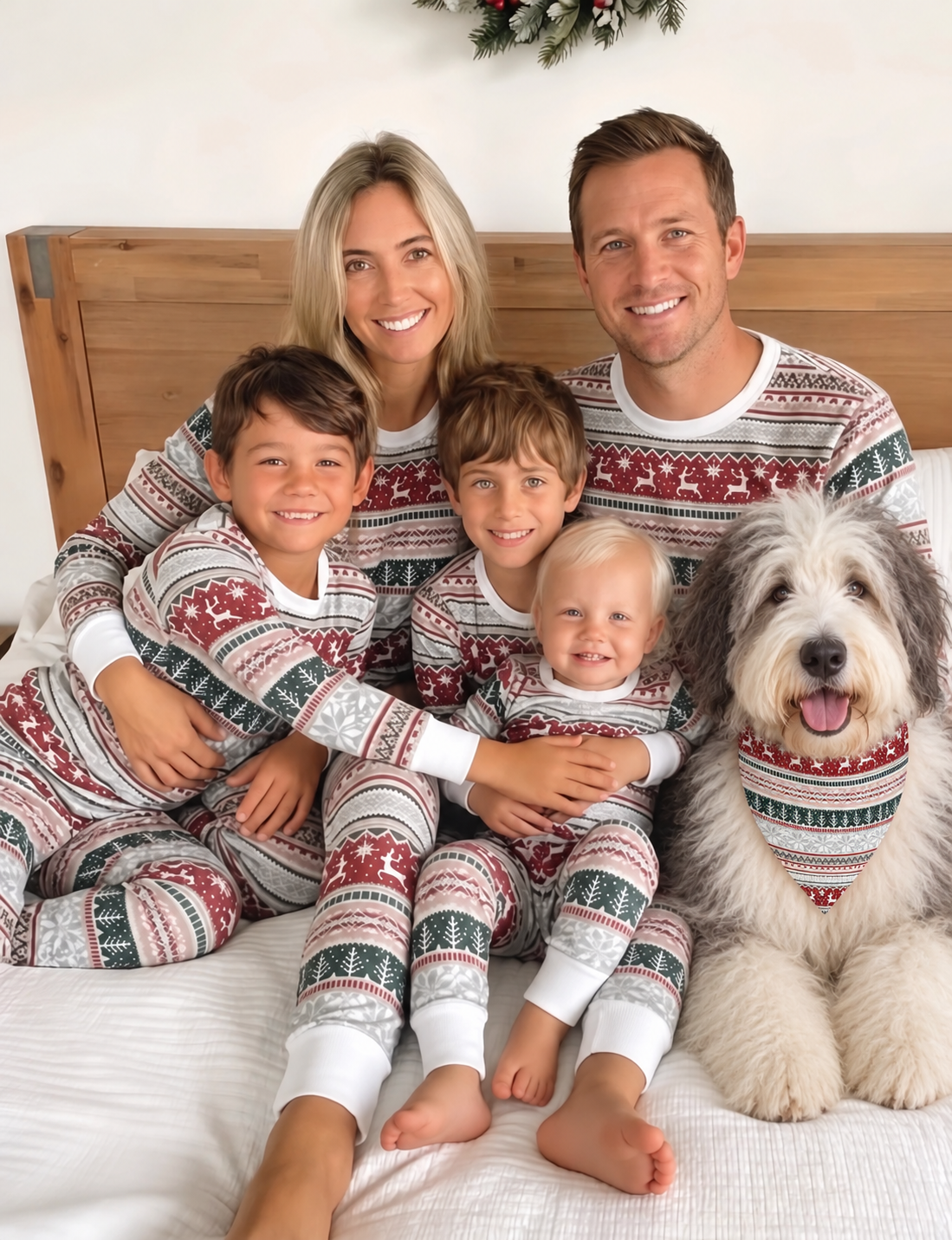 Family in matching Christmas pajamas with a Old English Sheepdog wearing the matching triangular dog bandana.