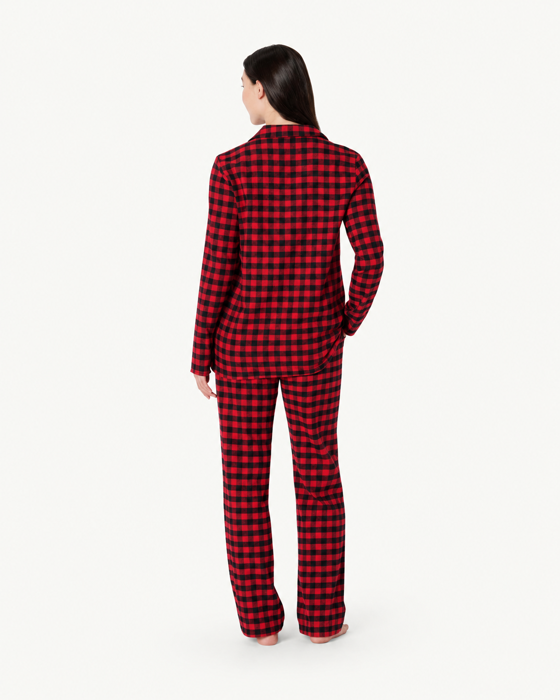 Back view of a woman in red and black check pajamas showing the long-sleeve shirt and full-length pants.
