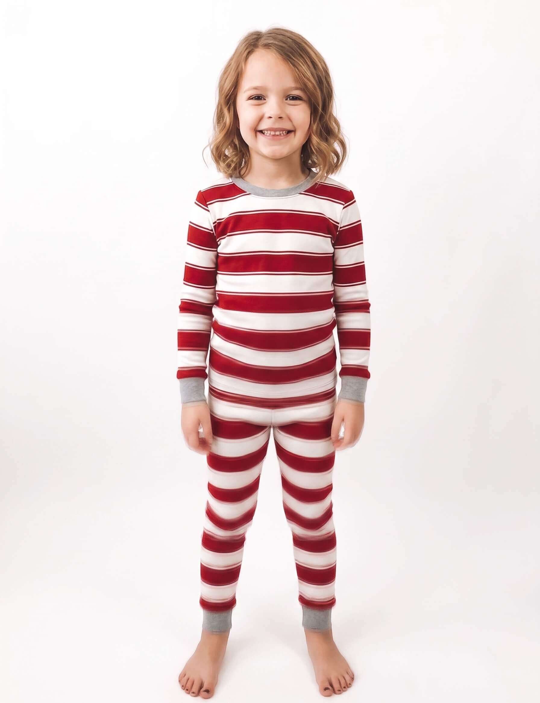 Girls' red and white striped holiday pajama set with crew neck and ribbed cuffs