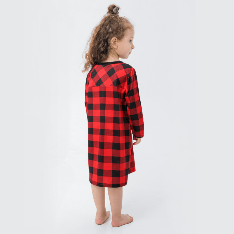 Side view of a girl wearing a red-and-black buffalo plaid long-sleeve nightdress.