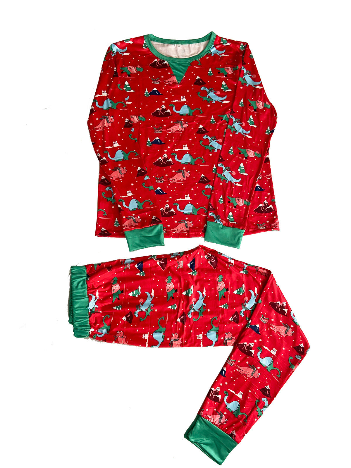 Flat lay of a red Christmas pajama top and pants with colorful dinosaur prints, green cuffs and a green neckline inset.
